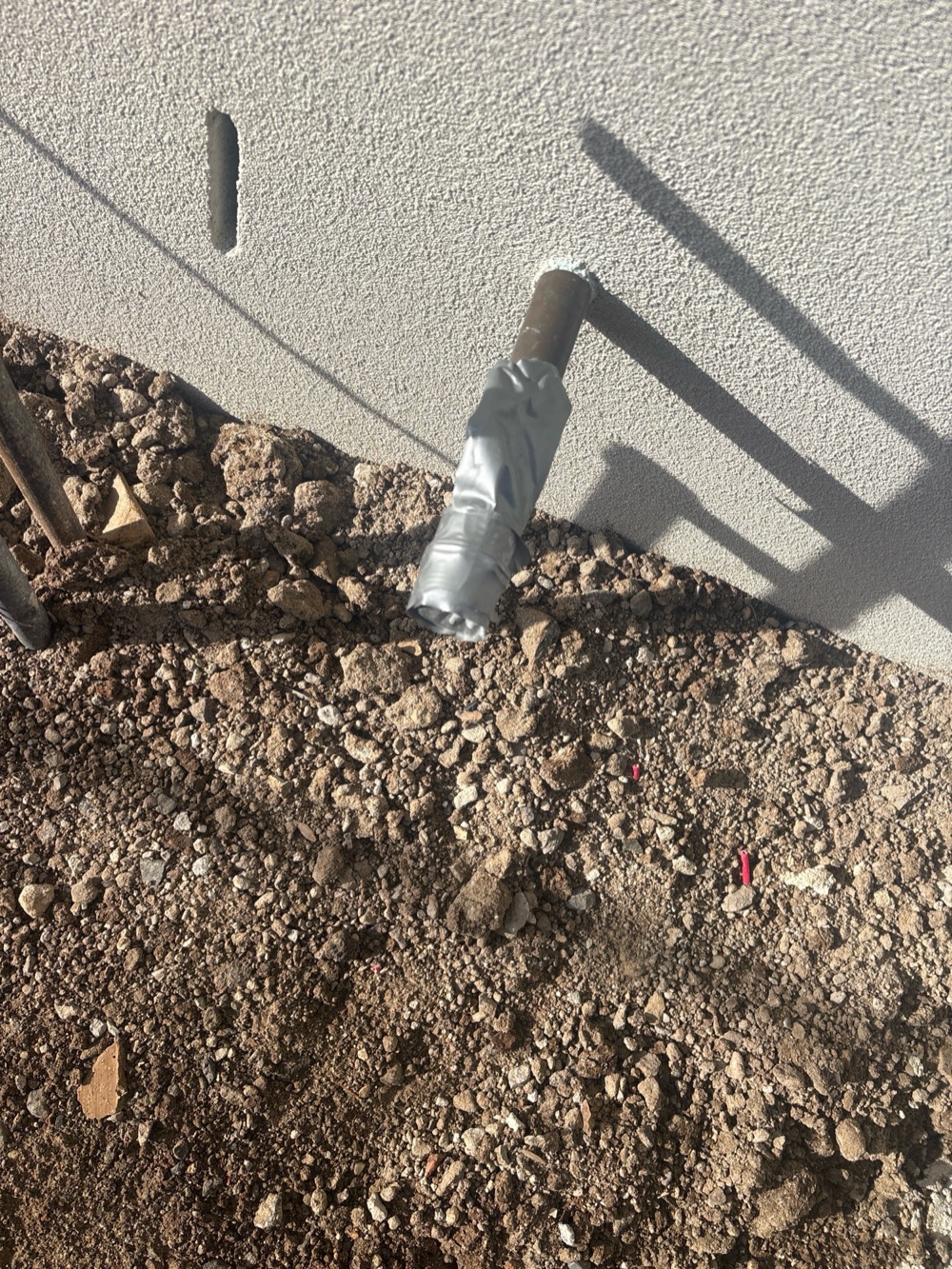 Gas pipe left uncapped against debris, recorded during a pre-handover inspection in Point Cook