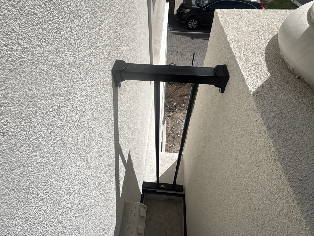 Balcony balustrade loose and unsecured at inspection, recorded during a pre-handover inspection in Point Cook