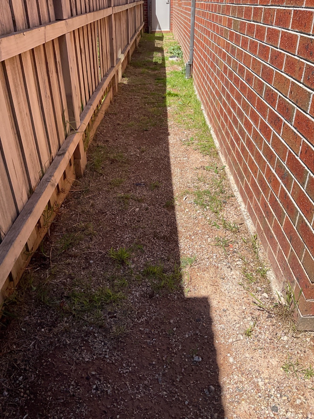 Ground grading sloping back towards the house, recorded during a building and pest inspection in Point Cook